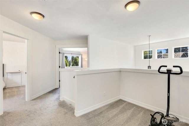 1803 65th Ct SE, Tumwater, WA 98501 - hallway with plenty of natural light, light carpet, and an upstairs landing