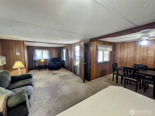 2302 R St SE Unit 108, Auburn, WA 98002 - living area with wooden walls, carpet floors, and healthy amount of natural light