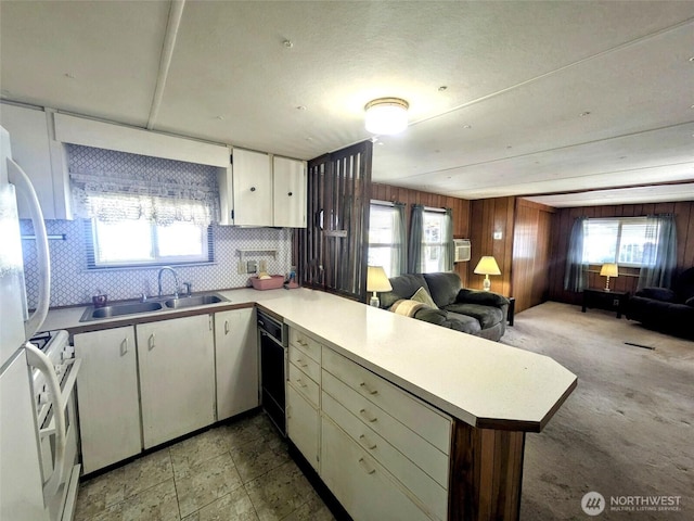 2302 R St SE Unit 108, Auburn, WA 98002 - kitchen featuring open floor plan, a peninsula, white appliances, and white cabinetry