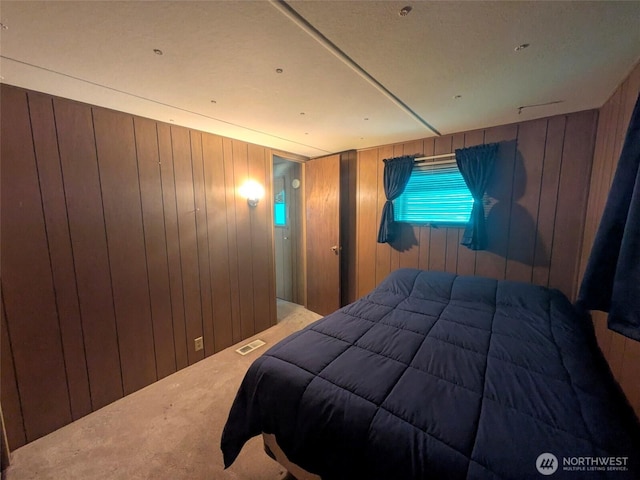 2302 R St SE Unit 108, Auburn, WA 98002 - bedroom featuring carpet floors and wood walls
