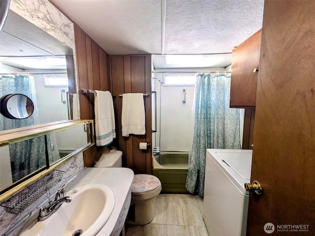 2302 R St SE Unit 108, Auburn, WA 98002 - bathroom featuring washer / clothes dryer, vanity, a textured ceiling, and shower / tub combo with curtain