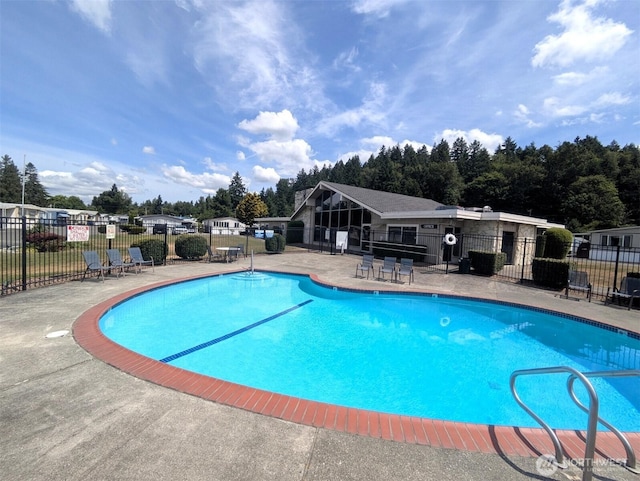2302 R St SE Unit 108, Auburn, WA 98002 - community pool featuring a patio area