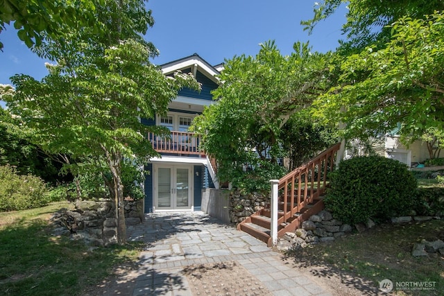 2110 N 88th St, Seattle, WA 98103 - view of front of home with french doors, stairs, and a patio