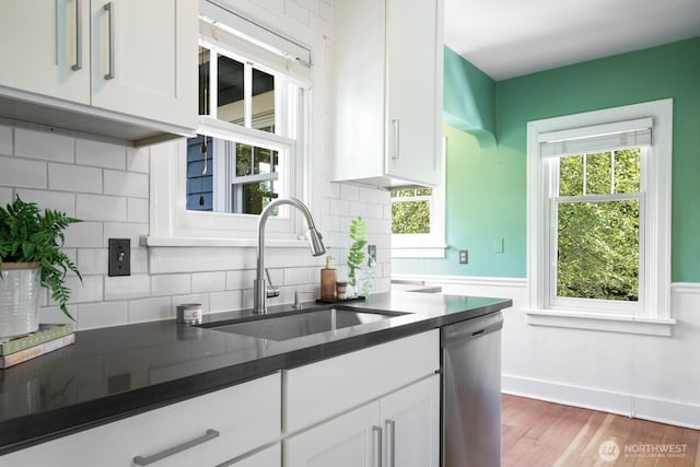 2110 N 88th St, Seattle, WA 98103 - kitchen with dishwasher, white cabinetry, and dark countertops