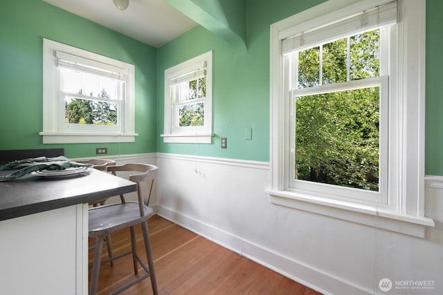 2110 N 88th St, Seattle, WA 98103 - dining space with a wainscoted wall and wood finished floors