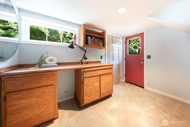 2110 N 88th St, Seattle, WA 98103 - kitchen featuring plenty of natural light, light carpet, light countertops, brown cabinets, and vaulted ceiling