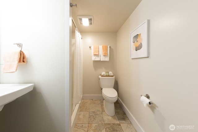 2110 N 88th St, Seattle, WA 98103 - full bathroom with a shower with shower curtain and stone finish flooring