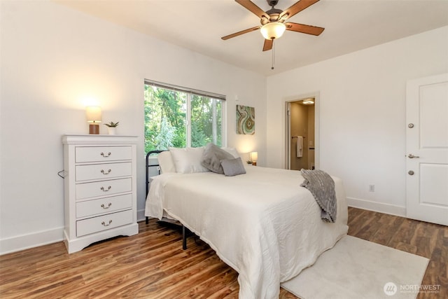 502 SW 326th St, Federal Way, WA 98023 - bedroom with wood finished floors, a ceiling fan, and connected bathroom