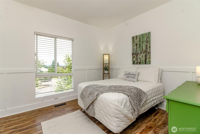 502 SW 326th St, Federal Way, WA 98023 - bedroom with a wainscoted wall, a decorative wall, and wood finished floors
