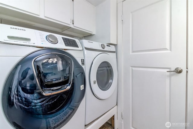 502 SW 326th St, Federal Way, WA 98023 - laundry area featuring cabinet space and washing machine and clothes dryer