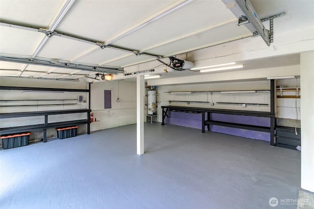 502 SW 326th St, Federal Way, WA 98023 - garage featuring a garage door opener and secured water heater