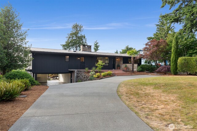 432 SW 206th St, Normandy Park, WA 98166 - view of front facade with driveway, covered porch, a chimney, a front yard, and a carport