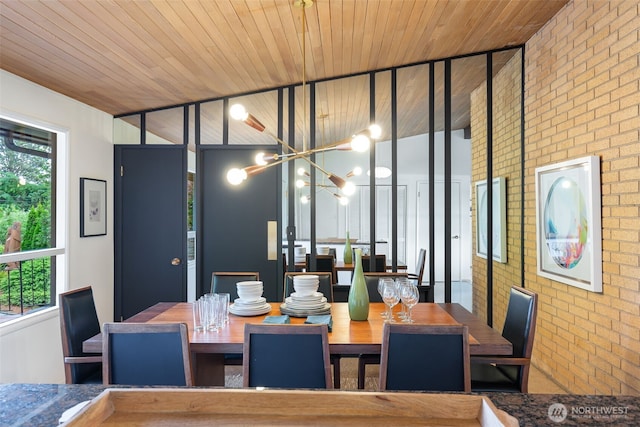 432 SW 206th St, Normandy Park, WA 98166 - dining space with brick wall, a chandelier, and wooden ceiling