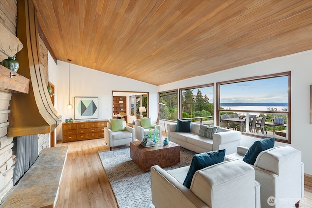432 SW 206th St, Normandy Park, WA 98166 - living area with vaulted ceiling, wood finished floors, a water view, wooden ceiling, and a fireplace