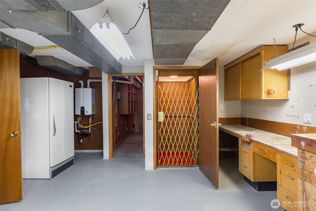 432 SW 206th St, Normandy Park, WA 98166 - below grade area featuring water heater, freestanding refrigerator, and a desk