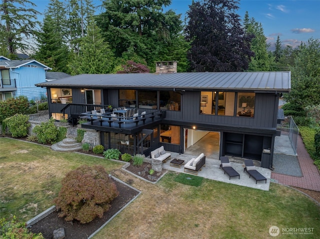 432 SW 206th St, Normandy Park, WA 98166 - rear view of house featuring an outdoor hangout area, a yard, a standing seam roof, and a metal roof