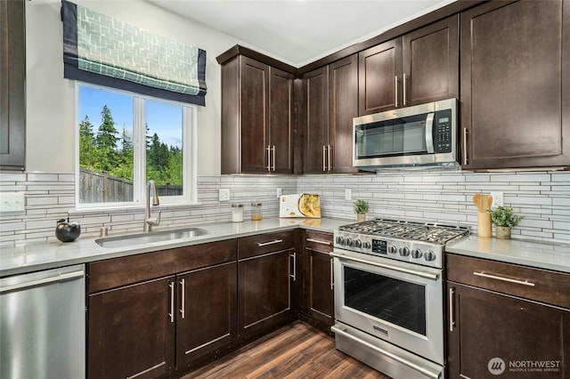 18405 15th Ave W, Lynnwood, WA 98037 - kitchen with appliances with stainless steel finishes, tasteful backsplash, light countertops, dark brown cabinets, and dark wood finished floors