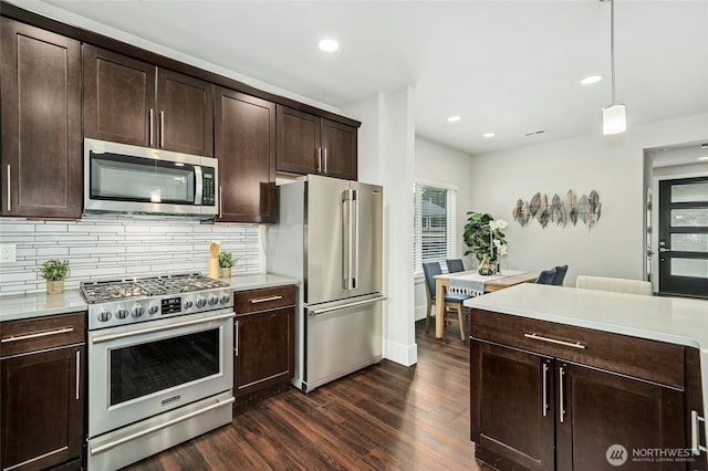 18405 15th Ave W, Lynnwood, WA 98037 - kitchen with appliances with stainless steel finishes, dark wood-type flooring, tasteful backsplash, healthy amount of natural light, and recessed lighting
