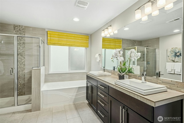 18405 15th Ave W, Lynnwood, WA 98037 - full bath featuring tile patterned floors, double vanity, a garden tub, a shower stall, and recessed lighting