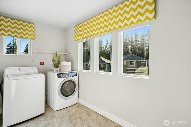 18405 15th Ave W, Lynnwood, WA 98037 - laundry area with washing machine and clothes dryer and baseboards