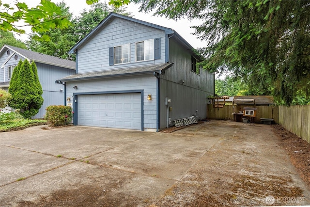 5626 29th Ct SE, Lacey, WA 98503 - view of property exterior with an attached garage and concrete driveway