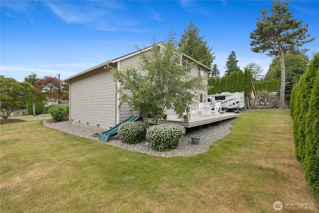 21206 9th Ave SE, Bothell, WA 98021 - view of side of home featuring a wooden deck and a yard