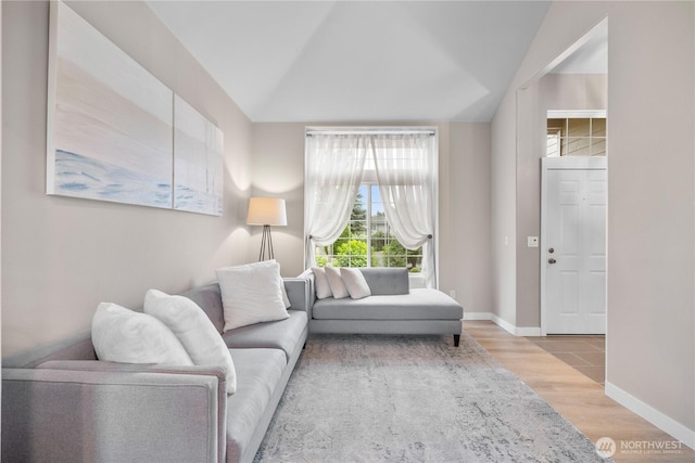 21206 9th Ave SE, Bothell, WA 98021 - living area featuring wood finished floors and vaulted ceiling