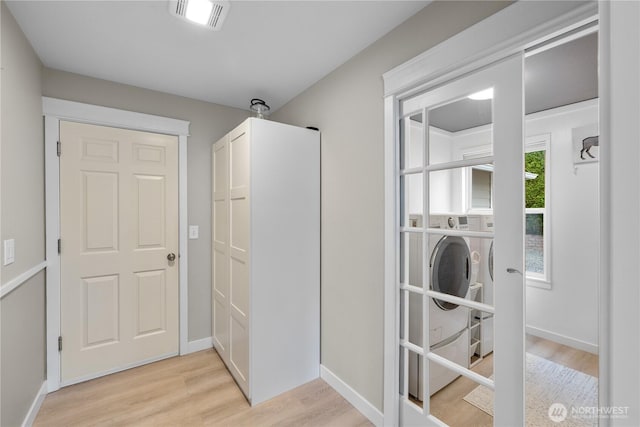 21206 9th Ave SE, Bothell, WA 98021 - laundry room with light wood-style floors and baseboards
