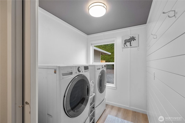 21206 9th Ave SE, Bothell, WA 98021 - washroom with washing machine and dryer and light wood finished floors