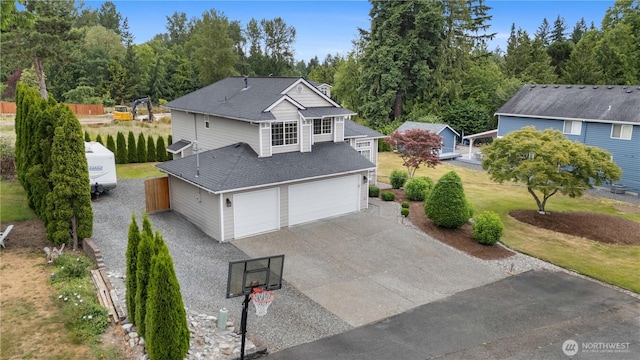21206 9th Ave SE, Bothell, WA 98021 - view of front of property featuring concrete driveway, roof with shingles, and an attached garage