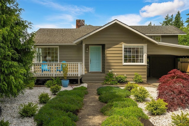 13247 2nd Ave NW, Seattle, WA 98177 - view of front of house with a chimney, roof with shingles, and a wooden deck