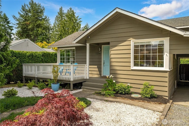 13247 2nd Ave NW, Seattle, WA 98177 - view of front of house with a wooden deck and roof with shingles