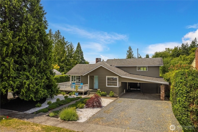 13247 2nd Ave NW, Seattle, WA 98177 - view of front of house with driveway, an attached carport, and a wooden deck