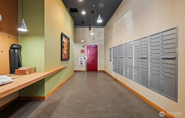 827 Hiawatha Pl S Unit 515, Seattle, WA 98144 - hallway featuring mail area, a towering ceiling, and elevator