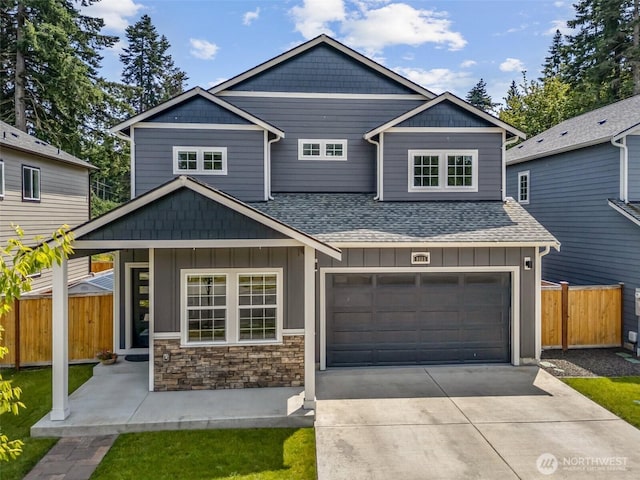 8665 Kimmie Loop SW, Tumwater, WA 98512 - craftsman inspired home featuring roof with shingles, board and batten siding, driveway, and an attached garage