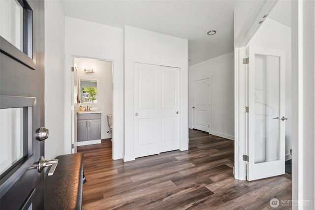 8665 Kimmie Loop SW, Tumwater, WA 98512 - unfurnished bedroom featuring dark wood finished floors, a closet, and ensuite bath
