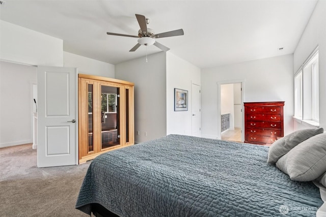 8665 Kimmie Loop SW, Tumwater, WA 98512 - bedroom featuring light colored carpet, vaulted ceiling, and a ceiling fan