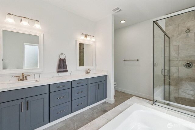 8665 Kimmie Loop SW, Tumwater, WA 98512 - bathroom with a stall shower, double vanity, and a bathtub