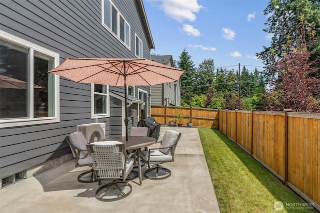 8665 Kimmie Loop SW, Tumwater, WA 98512 - fenced backyard with a patio and outdoor dining space