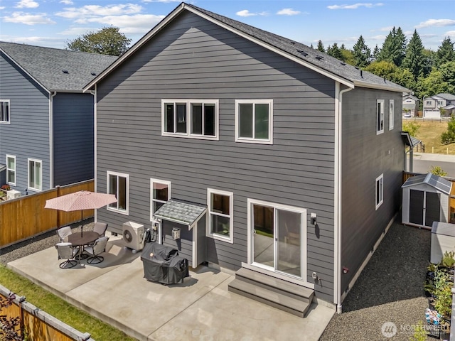 8665 Kimmie Loop SW, Tumwater, WA 98512 - rear view of house with a patio, entry steps, and a storage unit