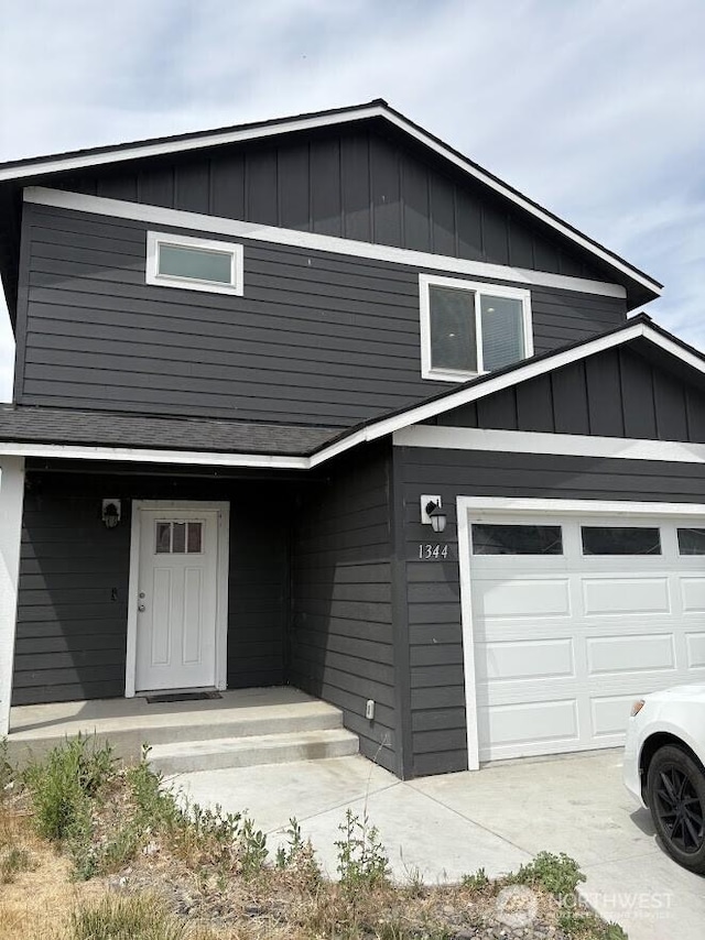 1344 Theo Way, Rock Island, WA 98850 - view of front of house featuring board and batten siding and driveway