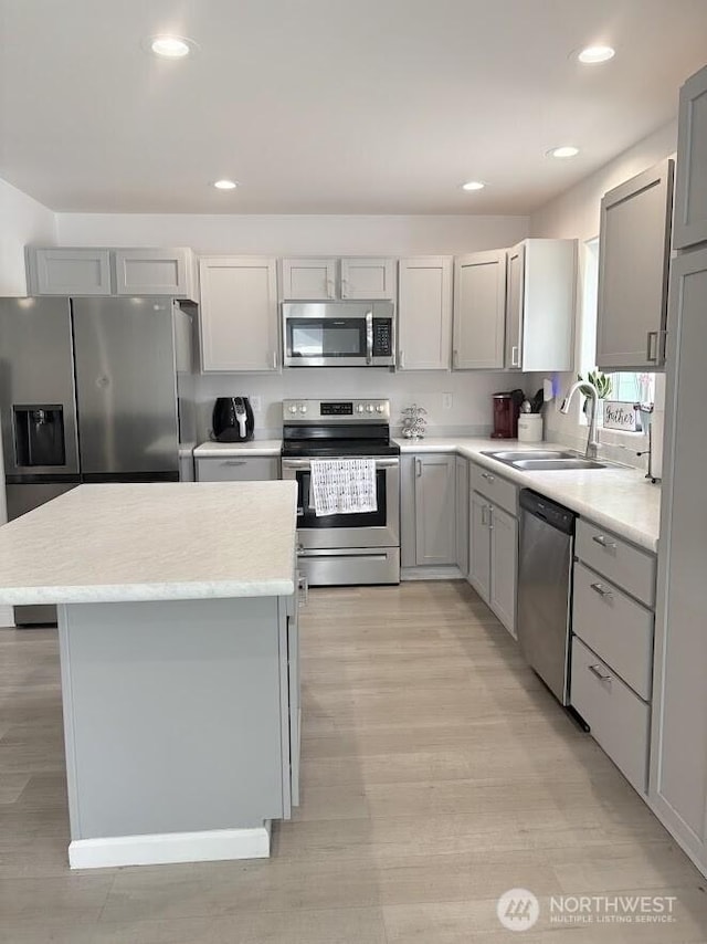 1344 Theo Way, Rock Island, WA 98850 - kitchen with stainless steel appliances, gray cabinetry, light wood-type flooring, light countertops, and recessed lighting