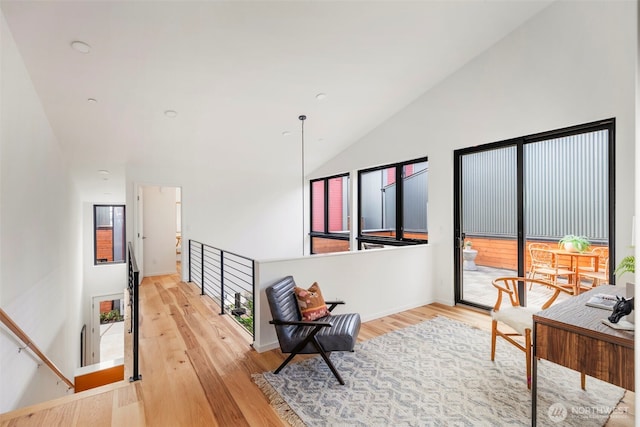 228 Canopy Path NW, Bainbridge Island, WA 98110 - corridor featuring vaulted ceiling, light wood-style floors, and an upstairs landing