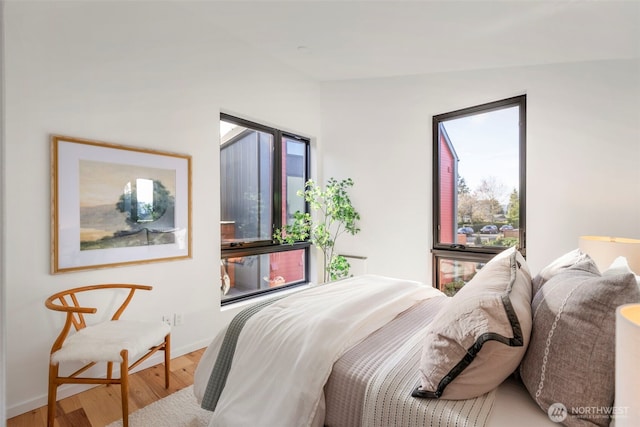228 Canopy Path NW, Bainbridge Island, WA 98110 - bedroom featuring wood finished floors and baseboards