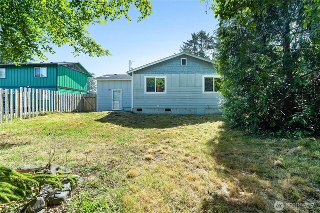 711 S Broadway St, Westport, WA 98595 - back of house with crawl space and board and batten siding