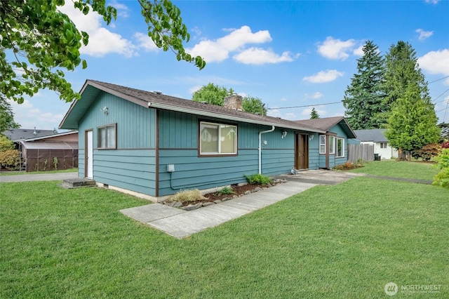120 E Mason Ave, Buckley, WA 98321 - view of front facade with a chimney and a front yard