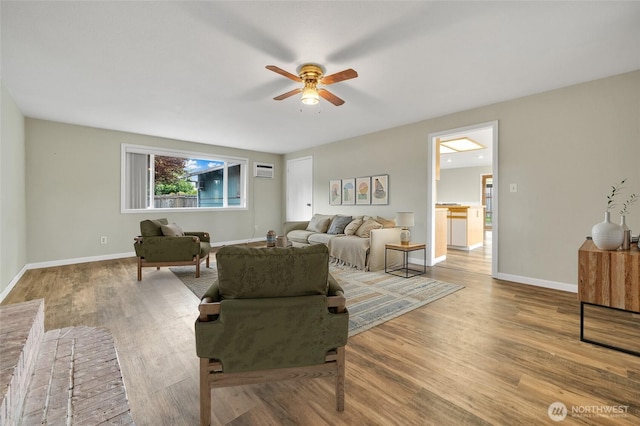 120 E Mason Ave, Buckley, WA 98321 - living area with a ceiling fan, wood finished floors, and an AC wall unit