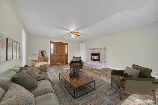 120 E Mason Ave, Buckley, WA 98321 - living area featuring wood finished floors, a ceiling fan, and a fireplace