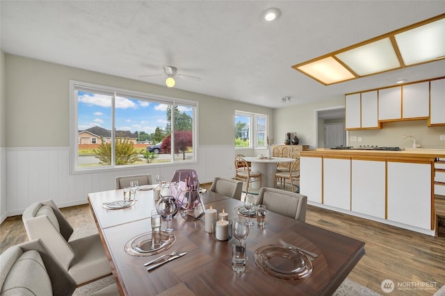 120 E Mason Ave, Buckley, WA 98321 - dining space featuring a wainscoted wall, wood finished floors, a ceiling fan, and recessed lighting