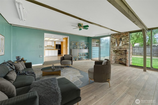 120 E Mason Ave, Buckley, WA 98321 - living area featuring ceiling fan, beam ceiling, and wood finished floors